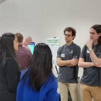 people talking to senior project designers